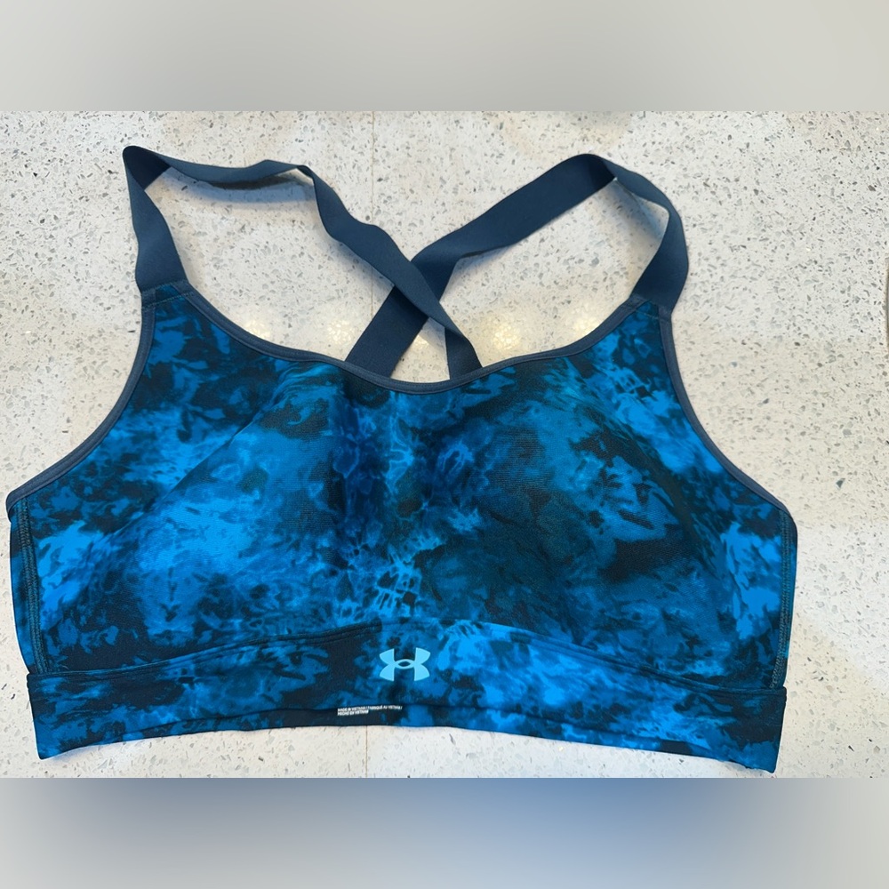 Two bras: Under Armour Women's Blue Sports Bra and white sports bra (L)